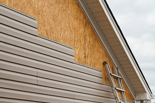 Professional Siding Installation technician working in Holly Springs, NC